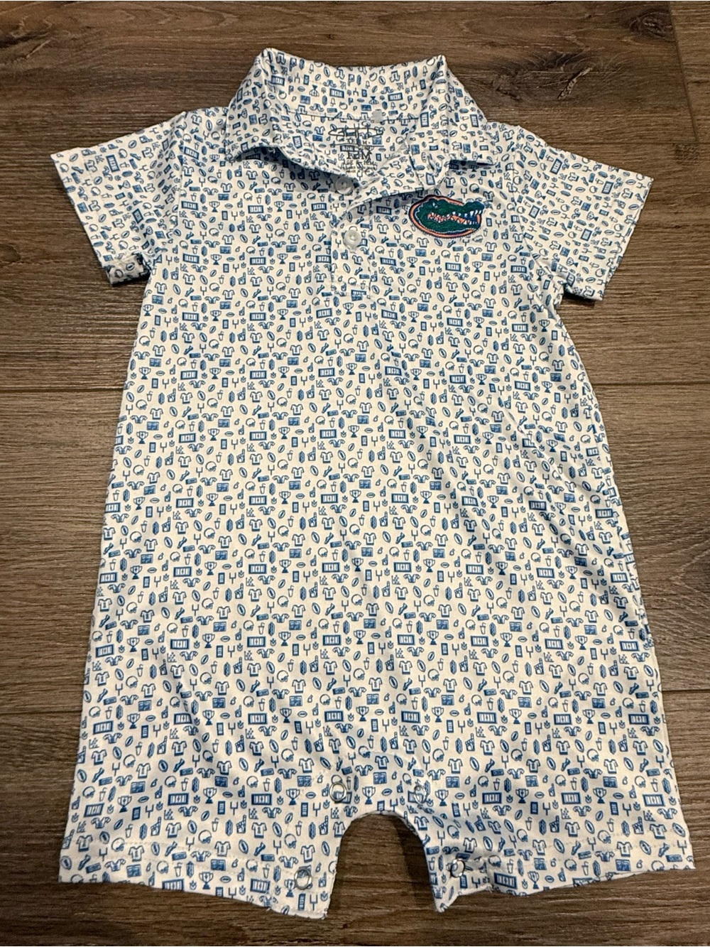Garb Florida Gators Infant Polo Romper with Blue Mini Football Print